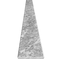 Close-up view of 5 x 24 Saddle Threshold Light Grey Marble Stone shows the top surface finish and bevel on both long edges