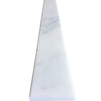 Close-up view of 4 x 48 Saddle Threshold White Marble Stone shows the top surface finish and bevel on both long edges