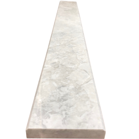 Close-up view of 4 x 32 Saddle Threshold Moon White Carrara Marble Stone shows the top surface finish and bevel on both long edges